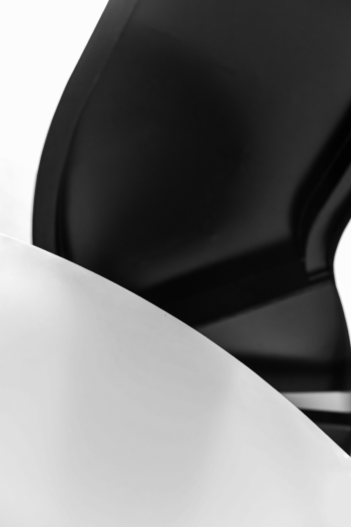 Black-and-white abstract photograph of curved forms
